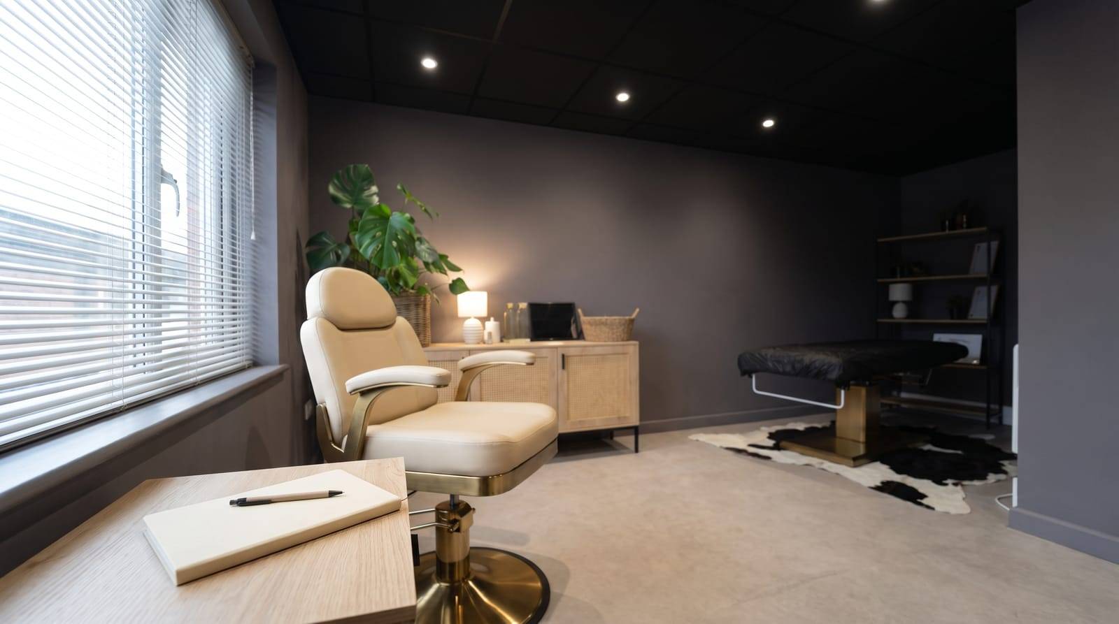 An empty consultation chair and a plain notepad in the Kennedy SMP Studio consulting room in Haverhill, set up for a second opinion on a hair transplant result